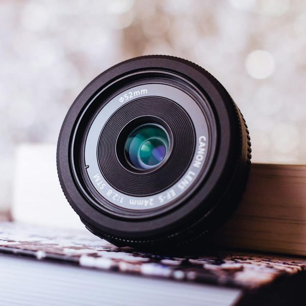 Abstract close up of a glass lens reflecting light.