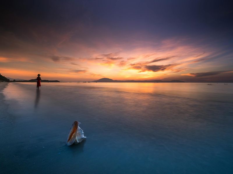 Detailed view of a person focusing on a distant horizon line.